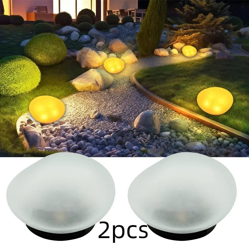 2pcs solar simulated pebble garden lights, frosted texture blends naturally, smart light control auto on/off, waterproof and weather-resistant, stable placement, ideal for garden, lawn, pathway, and landscape lighting.*Warm light