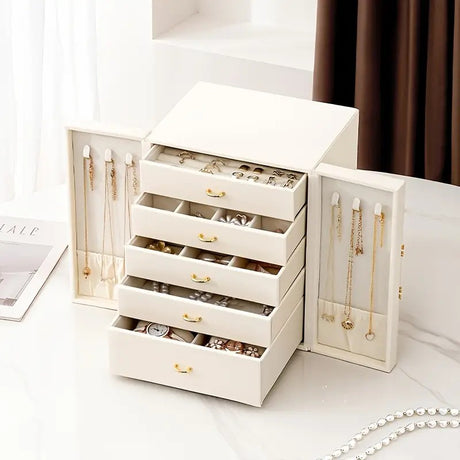White   1 Large Faux Leather Jewelry Storage Box with 5 Drawers and Gold Handles - An elegant rectangular storage space for rings, necklaces, bracelets, earrings, and watches - Features soft fabric lining, side door design, textured surface finish - Luxur