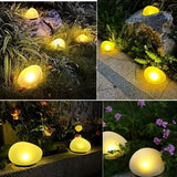 2pcs solar simulated pebble garden lights, frosted texture blends naturally, smart light control auto on/off, waterproof and weather-resistant, stable placement, ideal for garden, lawn, pathway, and landscape lighting.*Warm light